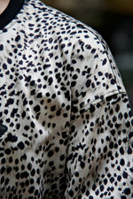Close-up of a shirt with a leopard print pattern