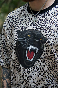 Person wearing a shirt with a panther graphic design